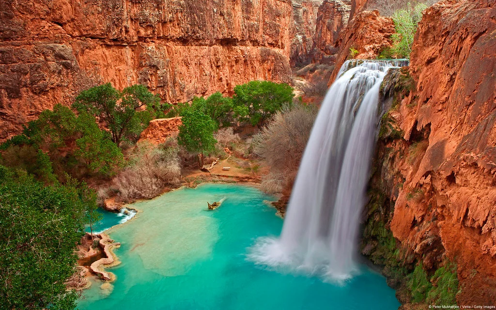 Havasu Falls dropping into a turquoise pool in Havasu Canyon