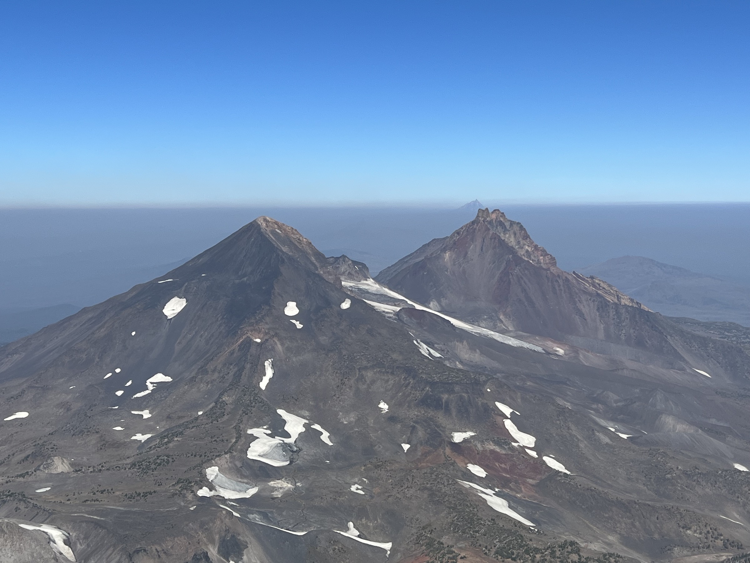 Middle Sister and North Sister viewed from the South Sister summit, Three Sisters Wilderness, Oregon