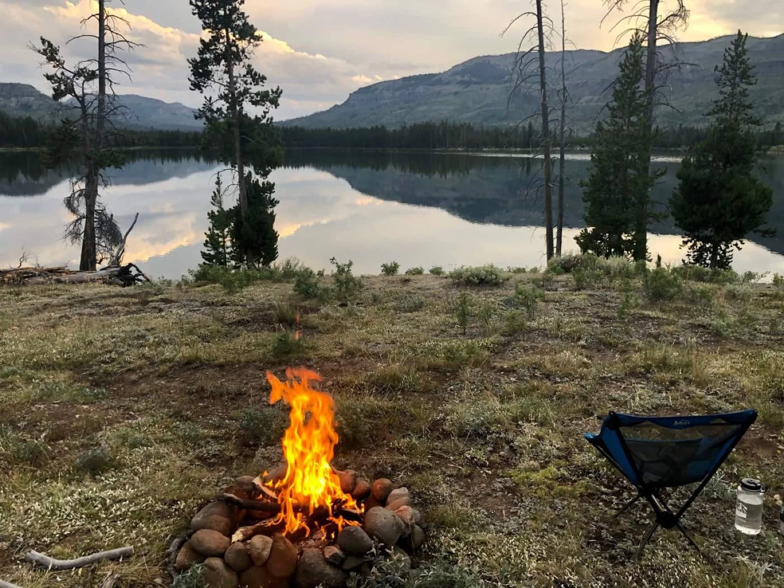 Bridger Lake camp with mountains and wilderness surrounding the shoreline