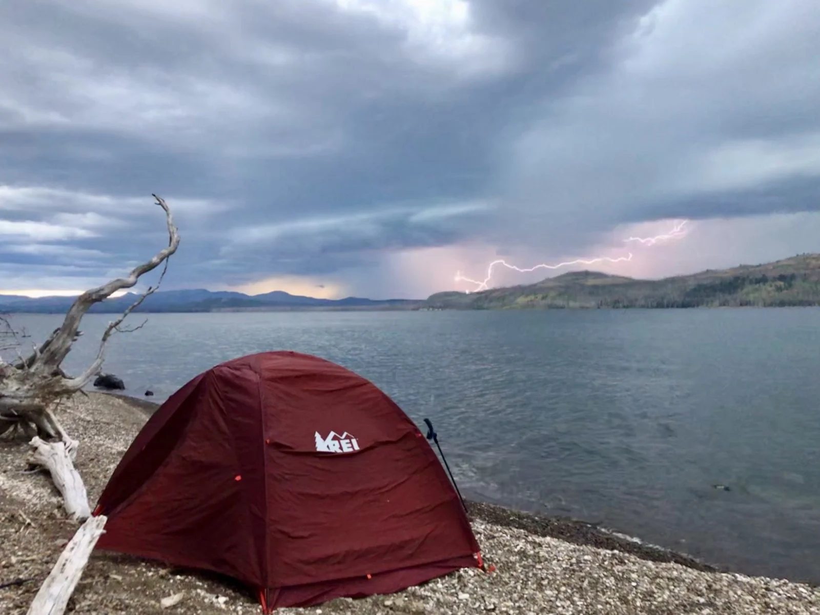 Lightning storm illuminating Yellowstone Lake from the campsite