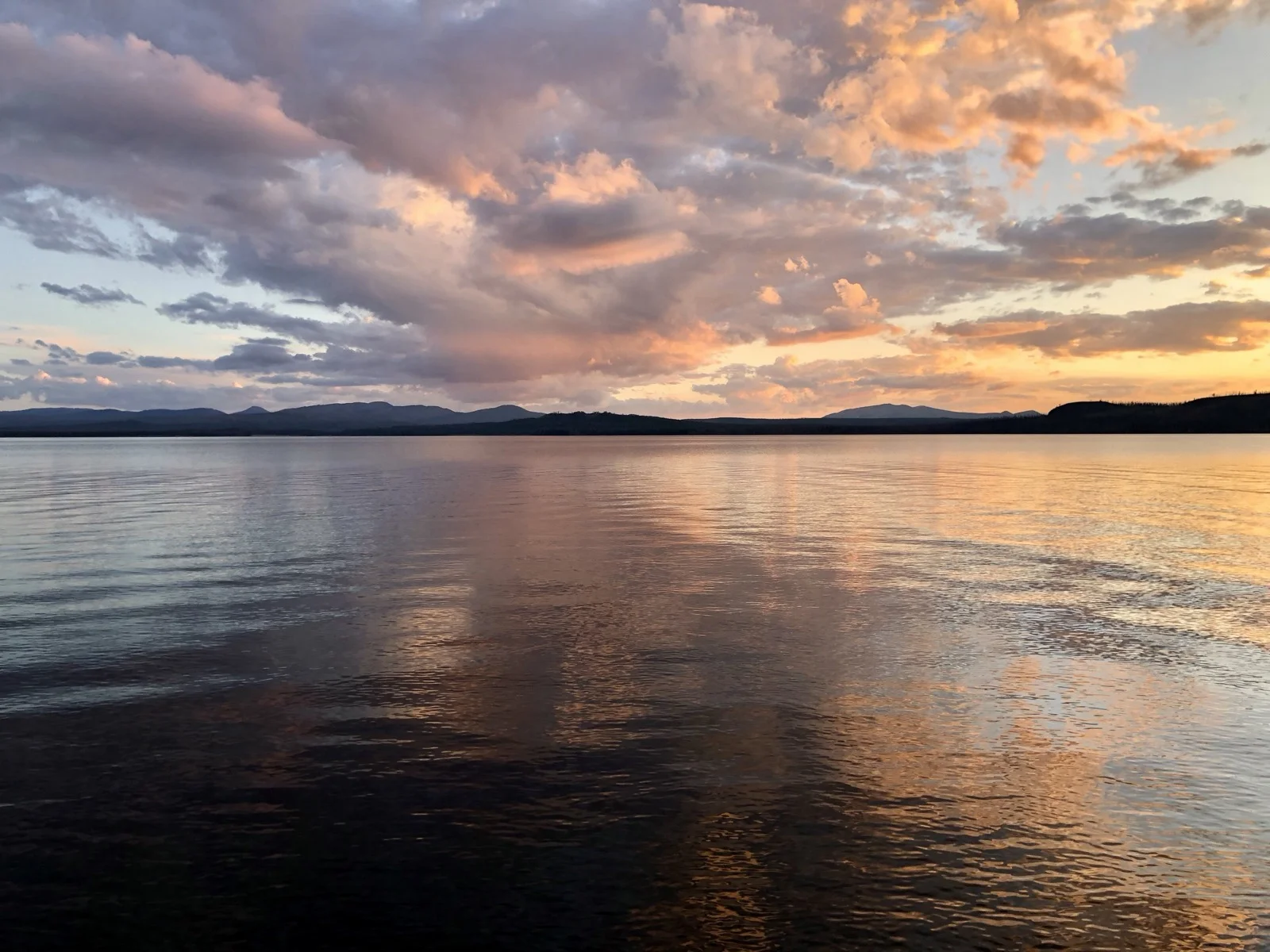 Golden hour light over Yellowstone Lake during the return journey